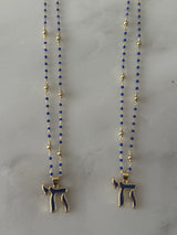 Blue Chai pendant on a beaded choker