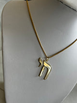 Chai Charm Necklace available in gold and silver.